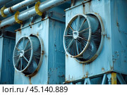 Industrial cooling fans bringing fresh air in an overheated environment. Стоковое AI-изображение, AI-художник Иван Рябоконь / Фотобанк Лори