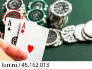 Cards and chips for poker on green table. Стоковое фото, фотограф Сергей Толмачёв / Фотобанк Лори