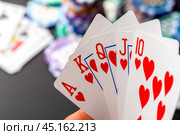 Cards and chips for poker on green table. Стоковое фото, фотограф Сергей Толмачёв / Фотобанк Лори