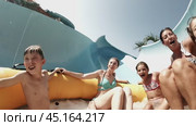 Phuket, Thailand, February 26, 2024: happy people on the slides at the water park. Редакционное видео, видеограф Igor Skripachev / Фотобанк Лори