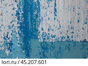 Peeling paint on the wall. Old concrete wall with cracked flaking paint. Weathered rough painted surface with patterns of cracks and peeling. High resolution texture for background and design. Closeup. Стоковое фото, фотограф Андрей Степанов / Фотобанк Лори