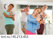 Parents together with their children learn how to dance salsa or boogie-woogie in dance class. Стоковое фото, фотограф Яков Филимонов / Фотобанк Лори