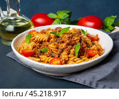Bolognese pasta. Fusilli with tomato sauce, ground minced beef. Стоковое фото, фотограф Natalia Gdovskaia / Фотобанк Лори