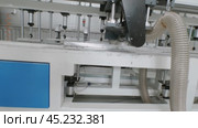 Factory's machinery, featuring a circular saw for metal, automatically cuts large aluminum sheets using numerical control. Стоковое видео, видеограф Strunov David / Фотобанк Лори
