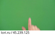 Gestures pack. Male hand touching, clicking, tapping and swiping on chromakey green screen. Zoom in, zoom out. Close up. 4K Footage Pack. Using for a smartphone, tablet pc or a touch screen devices. Стоковое видео, видеограф Марина Демидюк / Фотобанк Лори