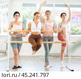 Young attendees of ballet courses posing by ballet barre. Стоковое фото, фотограф Яков Филимонов / Фотобанк Лори