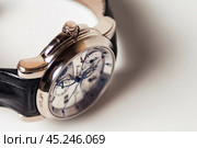 Munich, Swiss - 24 oct 2024: swiss wrist watch Ulysse Nardin SONATA Cathedral, close-up 3d. Silver wristband and bright steel dial, tachymeter, chronograph. Luxury watches concept. Copy ad text space. Редакционное фото, фотограф Aleksandr Golubev / Фотобанк Лори