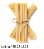 Bundles of uncooked pasta tied with raffia on white background. Стоковое AI-изображение, AI-художник Иван Рябоконь / Фотобанк Лори