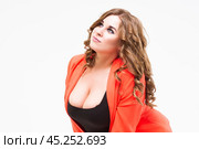 Plus size model with big breast and deep decollete, fat woman on white background, body positive concept. Стоковое фото, фотограф Станислав Тарко / Фотобанк Лори
