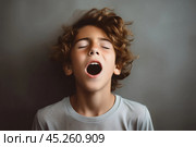 Young boy standing in front of wall, whim, looking up with surprised and state of shock or confusion, he heard or seen something unexpected or terrible. He very emotional expression sings songs. Стоковое AI-изображение, AI-художник Sergey Grishin / Фотобанк Лори