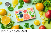 Pocket glucose meter surrounded by fresh fruits and vegetables promoting healthy diet. Стоковое AI-изображение, AI-художник Юрий Поздников / Фотобанк Лори