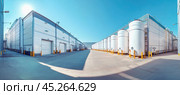 White industrial tanks containing liquid nitrogen for chemical or medical industry production. Стоковое AI-изображение, AI-художник Юрий Поздников / Фотобанк Лори