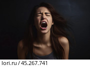 Beautiful face of sad woman screaming crying desperate and depressed with tears on her eyes suffering pain and depression isolated on black background in sadness facial expression and emotion concept. Стоковое AI-изображение, AI-художник Sergey Grishin / Фотобанк Лори