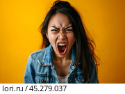 Screaming, hate, rage. Crying emotional angry asian woman screaming and yelling on gray studio background. Emotional, young face. Female close up portrait. Human emotions, facial expression concept. Стоковое AI-изображение, AI-художник Sergey Grishin / Фотобанк Лори