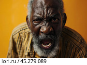 Expression of furious, enraged senior grey bearded afro man with grumpy grimace on his face, mouth opened in shout, ready to argue and swear, Angry black man yelling, screaming on yellow background. Стоковое AI-изображение, AI-художник Sergey Grishin / Фотобанк Лори