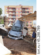 The aftermath of hurricane Dana in Valencia, Spain - Devastating consequences of flooding in Valencia, Spain, damaging cars and buildings. Стоковое фото, фотограф Данил Руденко / Фотобанк Лори