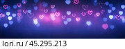 Glowing Hearts Against Vibrant Backdrop, Celebration Theme, Electric Love Symbols Hanging Decoration, Soft Focus Festive Mood Image Suitable for Event Promotion or Sentimental Projects. Стоковое AI-изображение, AI-художник Павел Муравьев / Фотобанк Лори