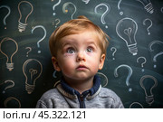 Development and education of children. A thoughtful boy on a dark background with a light bulb and question marks . Brainstorming and the concept of an idea. Стоковое AI-изображение, AI-художник Photojuli / Фотобанк Лори