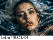 The girl is wrapped in cellophane or a bag. The girl is suffocating. Plastic pollution of the planet. Environmental hazard. Reducing the reuse of plastic. Recycling. The concept of garbage. Стоковое AI-изображение, AI-художник Photojuli / Фотобанк Лори