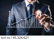 The concept of value growth in real estate, energy efficiency rating. Real estate online on virtual screens. New family housing, apartment purchase, house search, land price, real estate tax. Стоковое AI-изображение, AI-художник Photojuli / Фотобанк Лори