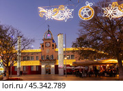 Sants Coloma de Gramenet, Spain - 20 December 2023: City hall of city Sants Coloma de Gramenet at Christmas time. Spain. Редакционное фото, фотограф Яков Филимонов / Фотобанк Лори