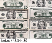 Close-up of paper American dollar bills. Dollar bills of 20 dollars lie face down and back down in a row on the table. Money financial background. Flat lay, close-up, top view. Стоковое фото, фотограф Виктория Катьянова / Фотобанк Лори