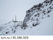 Winter landscape with a TV tower, antennas and satellite dishes on top of a snow-covered mountain. Стоковое фото, фотограф Андрей Степанов / Фотобанк Лори