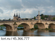 View of the embankment with ancient houses and the Jacques Gabriel Bridge over the Loire River on a sunny summer day, Blois, Loire and Cher, France. Стоковое фото, фотограф Ula Ulachka / Фотобанк Лори