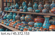 Souvenirs on the market. Old Arabic bazaar shopping in outdoor market. Travel and vacation concept. Slow motion footage. Стоковое AI-видео, аниматор Ирина Михайличенко / Фотобанк Лори