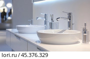 Modern white bathroom sinks with chrome faucets and soap dispenser. Стоковое AI-изображение, AI-художник Юрий Поздников / Фотобанк Лори