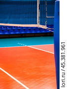 Volleyball courts in sport hall with net in sporty gym for banner, no one. Professional volleyball court, sport backdrop. Team game success, healthy sporty lifestyle concept. Copy ad text space poster. Стоковое фото, фотограф Aleksandr Golubev / Фотобанк Лори