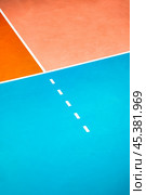 Professional volleyball courts with white lines, nobody. Crop photo of orange volleyball court in sport gym, sporty backdrop. Team game success, healthy sporty lifestyle concept. Copy ad text space. Стоковое фото, фотограф Aleksandr Golubev / Фотобанк Лори