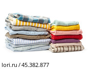 stack of clothing isolated on white. Стоковое фото, фотограф Сергей Толмачёв / Фотобанк Лори