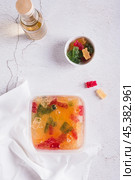Marmalade candies are infused in lemonade for subsequent freezing top and vertical view. Стоковое фото, фотограф Елена Руй / Фотобанк Лори