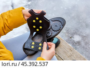10 stainless steel spikes, which provides traction on icy and snowy surfaces, to avoid slipping. Стоковое фото, фотограф Владимир Григорьев / Фотобанк Лори