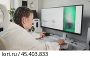 Young woman types prompt task on keyboard and observes result of image generation using neural network. Process of artificial intelligence in implementation of designer tasks. AI helps the designer. Стоковое AI-видео, аниматор Енваев Андрей / Фотобанк Лори
