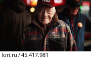 Elderly man with "Voted" badge. Election Day concept. Стоковое AI-изображение, AI-художник Решат Алиев / Фотобанк Лори