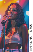 Young singer performing live on stage with microphone and colorful lights. Стоковое AI-видео, аниматор Юрий Поздников / Фотобанк Лори