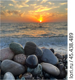 Sunset on a pebble beach - on the Black Sea coast in Kobuleti, Georgia. Стоковое фото, фотограф IRYNA ZAKHARANKA / Фотобанк Лори