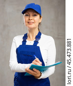 Smiling adult woman in uniform making notes. Стоковое фото, фотограф Яков Филимонов / Фотобанк Лори