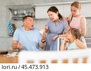 Dissatisfied woman demanding money from perplexed husband at home. Стоковое фото, фотограф Яков Филимонов / Фотобанк Лори