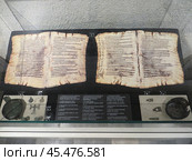 Varna, Bulgaria. July 30, 2024.Aladzha Monastery. Medieval Orthodox Christian cave monastery museum complex. Interior exhibition. Pages from a psalter. Редакционное фото, фотограф Мария Фетисова / Фотобанк Лори