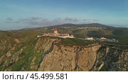 Aerial view of lighthouse at Cape Roca in Portugal (2019 год). Стоковое видео, видеограф Михаил Коханчиков / Фотобанк Лори