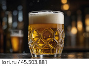 A glass of cold beer is on the table in the pub. Стоковое AI-изображение, AI-художник Александр Поташев / Фотобанк Лори
