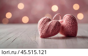 The banner. Background for Valentine's Day. Knitted hearts with festive lights in the form of a side in the background. a mock-up of an invitation card for a Valentine's Day party, a place to copy. Стоковое AI-изображение, AI-художник Photojuli / Фотобанк Лори