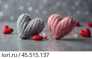 The banner. Background for Valentine's Day. Knitted hearts with festive lights in the form of a side in the background. a mock-up of an invitation card for a Valentine's Day party, a place to copy. Стоковое AI-изображение, AI-художник Photojuli / Фотобанк Лори