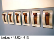 A range of automatic fuses are in the on position. Стоковое фото, фотограф Татьяна Степанищева / Фотобанк Лори