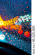 Raindrops cling to the surface of car glass, distorting a vibrant cityscape at evening, where colorful lights from traffic and buildings merge into a beautiful display. Generative AI. Стоковое AI-изображение, AI-художник Юлия Петровская / Фотобанк Лори