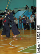Nizhny Novgorod, Russia, 11.24.2024 Gagarin Avenue 25 d Russian Kendo Championship. Athletes in protective equipment with a sword and a protective helmet at competitions. Редакционное фото, фотограф Egor Sarantstv / Фотобанк Лори