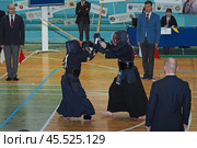Nizhny Novgorod, Russia, 11.24.2024 Gagarin Avenue 25 d Russian Kendo Championship. Athletes in protective equipment with a sword and a protective helmet at competitions. Редакционное фото, фотограф Egor Sarantstv / Фотобанк Лори